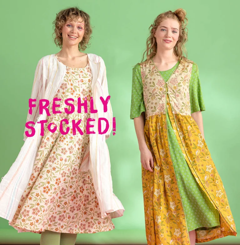 Two women wearing dresses from Gudrun Sjödén. 