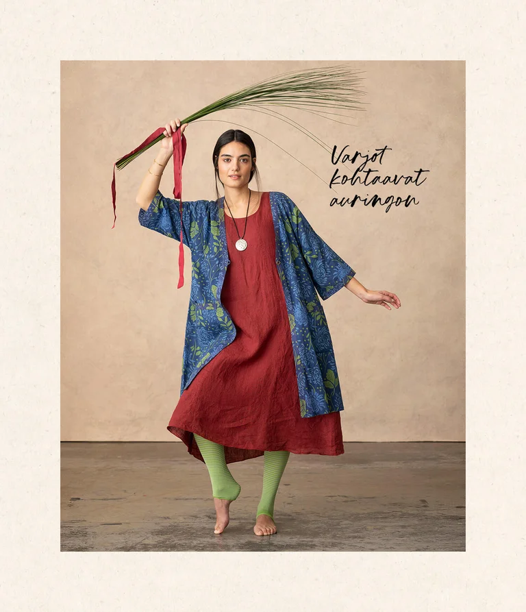 A woman wearing a dress and tunic from Gudrun Sjödén.  