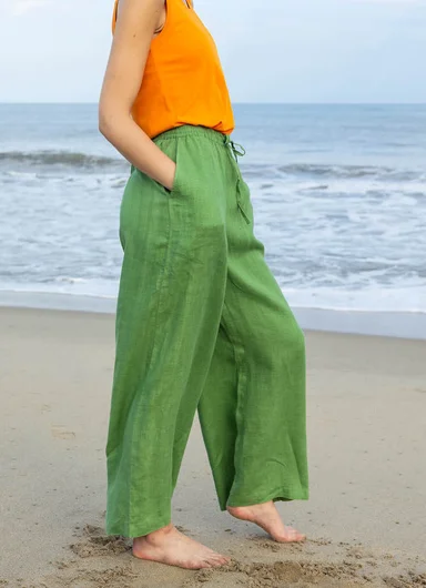 A lower body wearing green wide-leg trousers from Gudrun Sjödén.