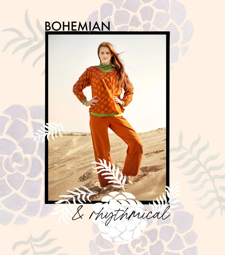 A woman wearing a patterned blouse and orange pants from Gudrun Sjödén.
