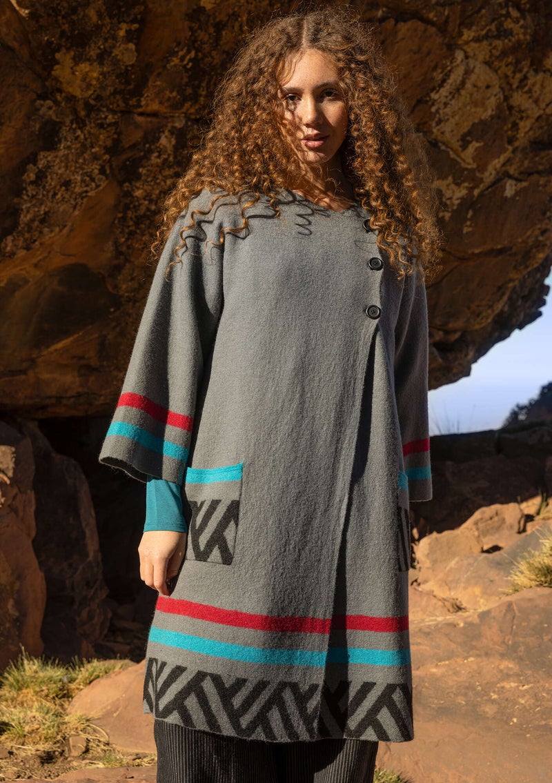 “Horizon” knitted coat crafted from felted organic wool graphite