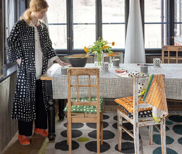 A kitchen decorated with textile and ceramic items from Gudrun Sjödén’s winter 2025 Home collection.