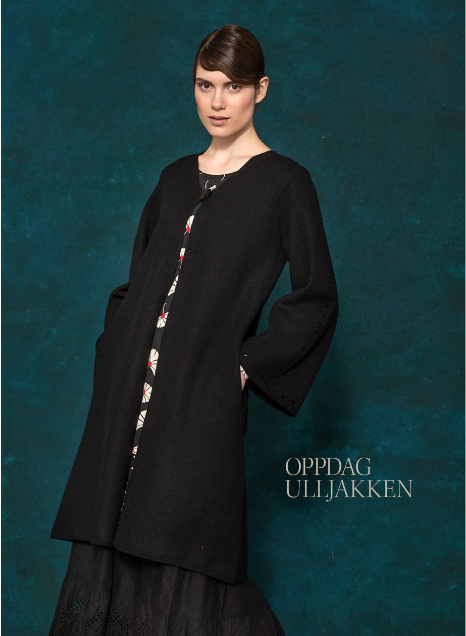A wonderful wool cardigan  with a pretty V-neck, snug side pockets and trumpet-shaped sleeves.