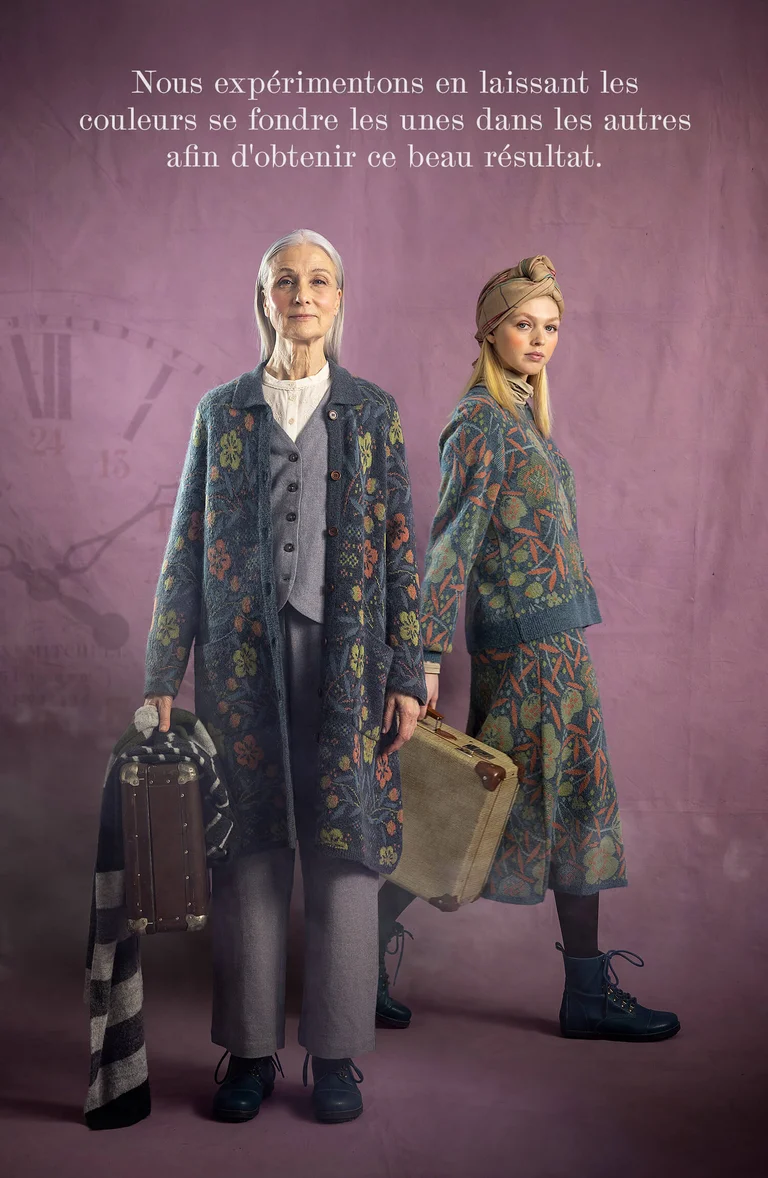 Two women with suitcases in their hands wearing layers of clothing from Gudrun Sjödén.