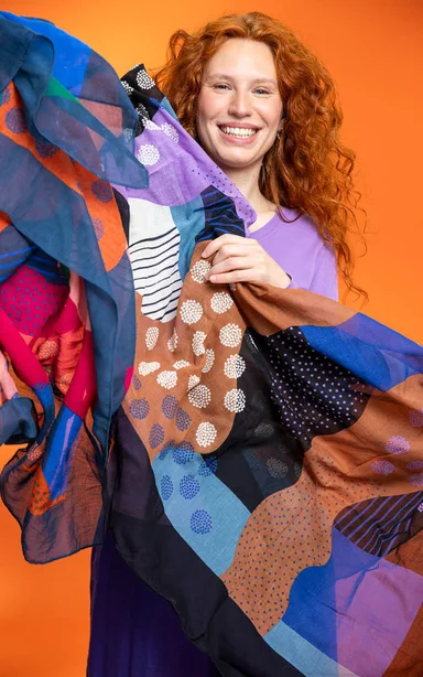 A woman wearing accessories from Gudrun Sjödén.