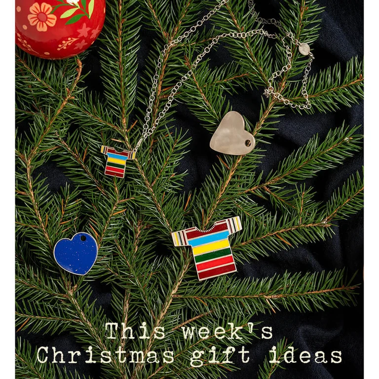 Necklace, charms and a silver brooch from Gudrun Sjödén. All hanging in a Christmas tree. 