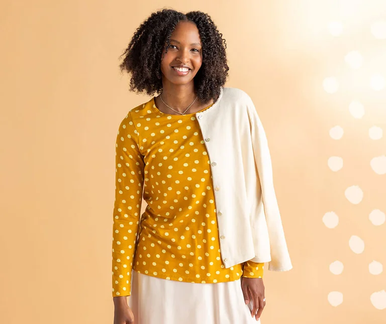 A woman wearing a dotted top from Gudrun Sjödén. 