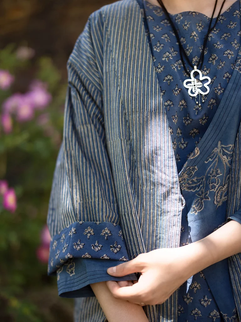 A woman wearing a block-printed kimono from Gudrun Sjödén.