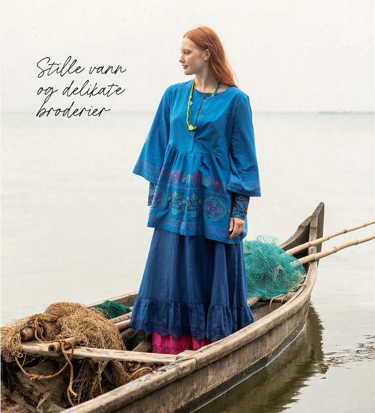 A woman wearing a graphic-patterned dress from Gudrun Sjödén.  