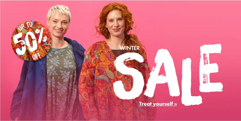 Two women wearing colourful clothes from Gudrun Sjödén.