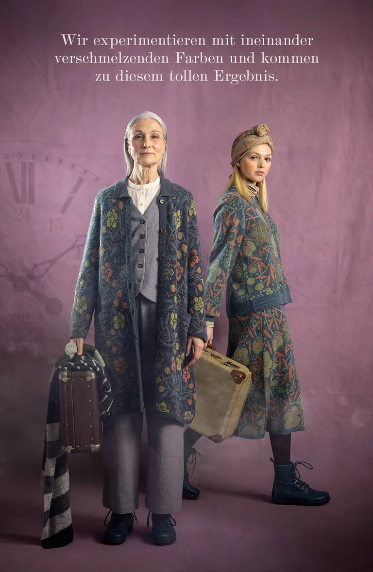 Two women with suitcases in their hands wearing layers of clothing from Gudrun Sjödén.