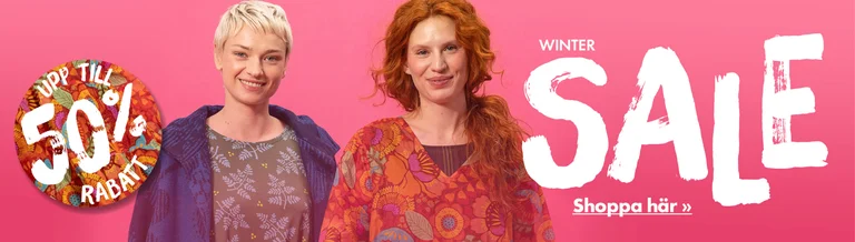 Two women wearing colourful clothes from Gudrun Sjödén.