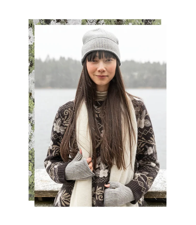 A woman wearing knitted accessories from Gudrun Sjödén.  