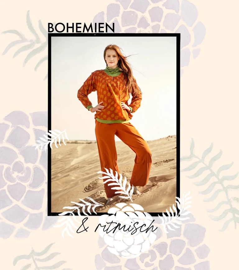 A woman wearing a patterned blouse and orange pants from Gudrun Sjödén.