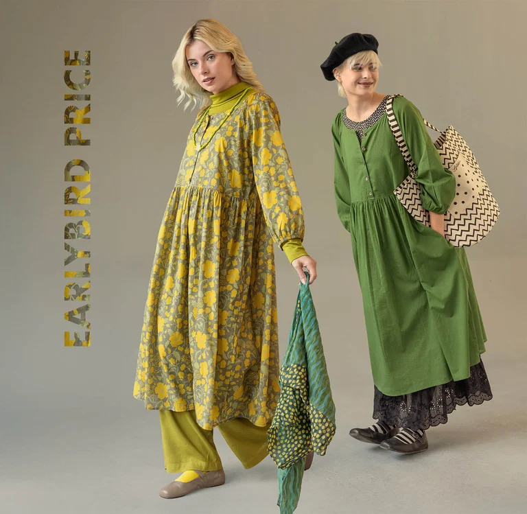 Two women wearing dresses, one solid coloured, the other patterned, from Gudrun Sjödén.