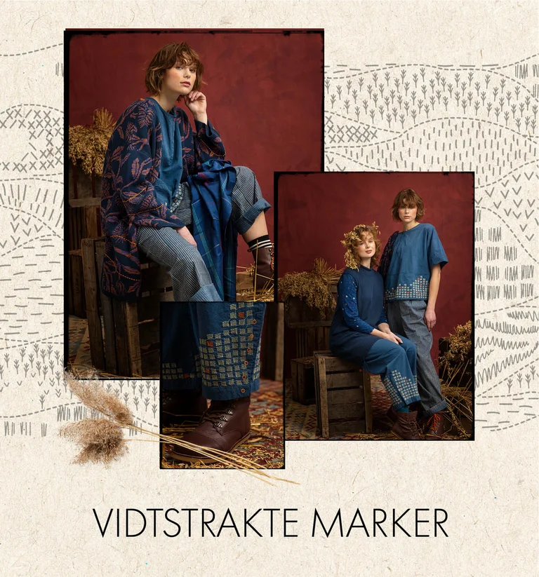 En kvinde iført en broderet, vævet kjole i indigoblå fra Gudrun Sjödén.