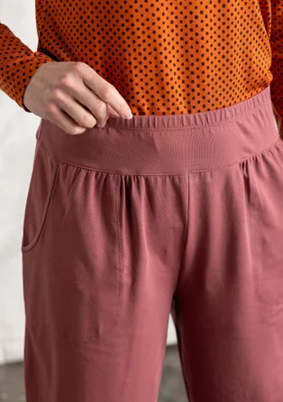 Organic cotton/elastane jersey trousers - dusty red