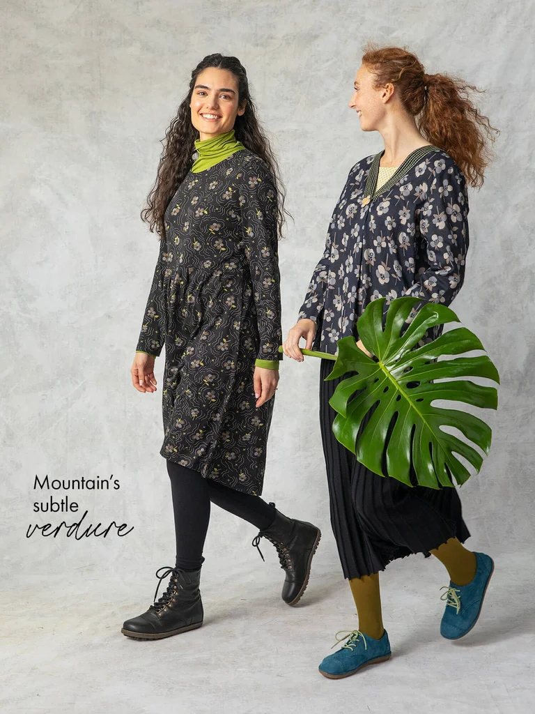 Two women wearing patterned clothes from Gudrun Sjödén. 