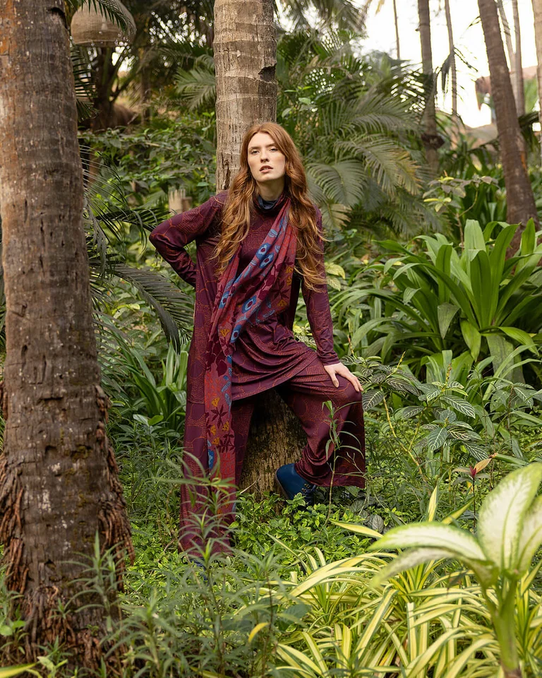 A woman wearing a tunic and trousers from Gudrun Sjödén. 