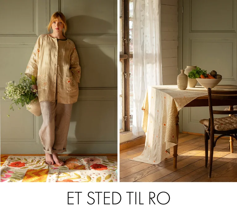 A woman in the “Nemorosa” linen tunic from Gudrun Sjödén on a floral rug from Gudrun Sjödén.