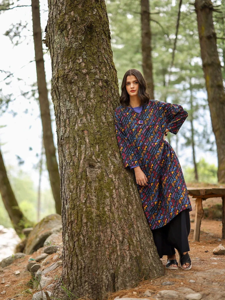 A woman wearing a graphic-patterned dress from Gudrun Sjödén.