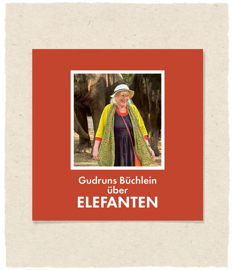 Das Cover von Gudrun Sjödéns Buch über Elefanten, auf dem Gudrun selbst lächelnd vor zwei Elefanten zu sehen ist.