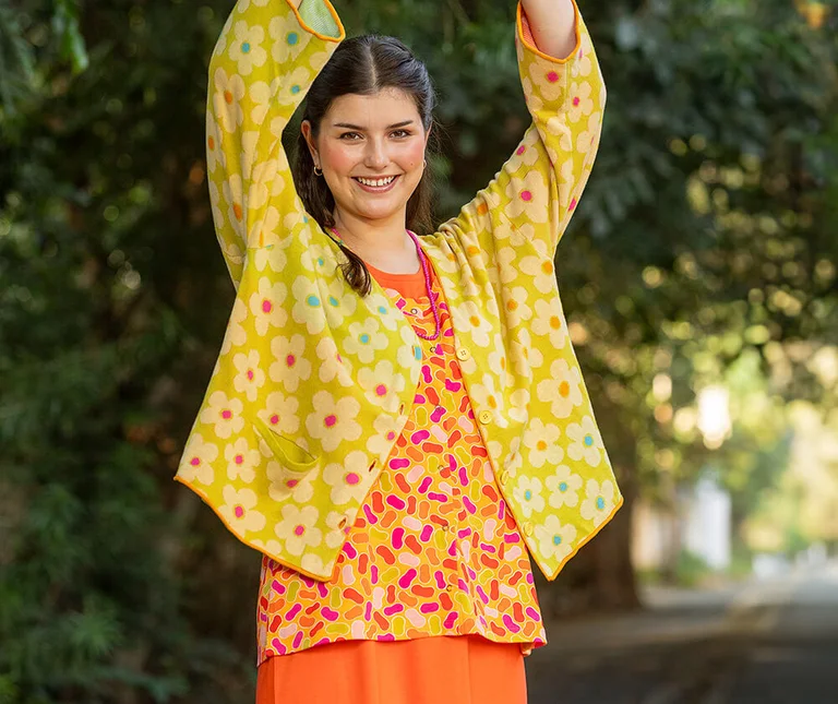 A woman wearing patterned clothes from Gudrun Sjödén. 