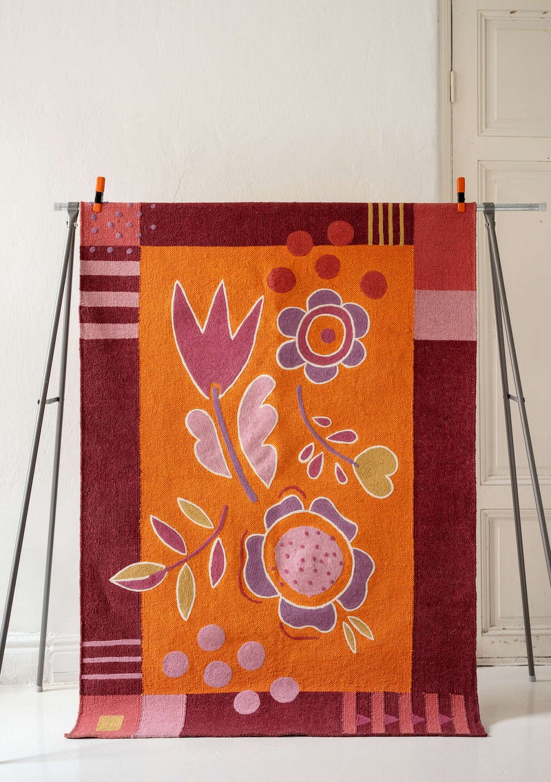 “Flowers” embroidered rug in organic cotton agate red