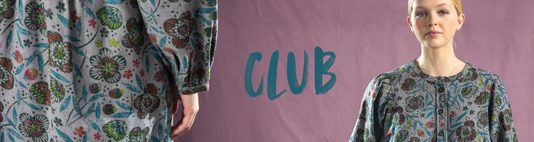 A women wearing Gudrun Sjödén clothing stand against a neutral background, with the text 'Club' on the left.