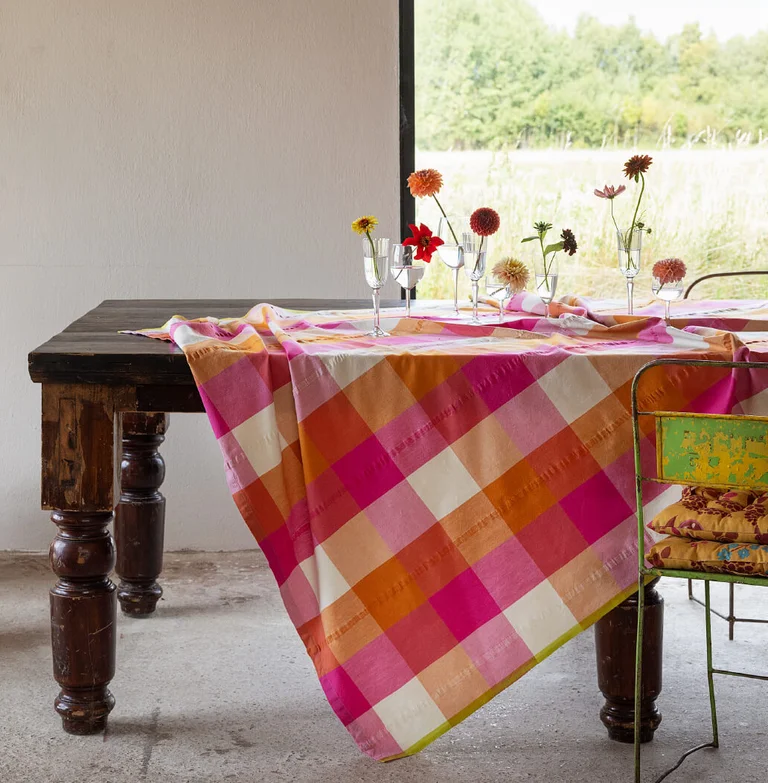 A table with a check tablecloth from Gudrun Sjödén.