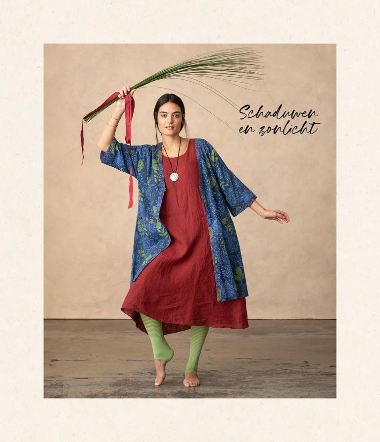 A woman wearing a dress and tunic from Gudrun Sjödén.  