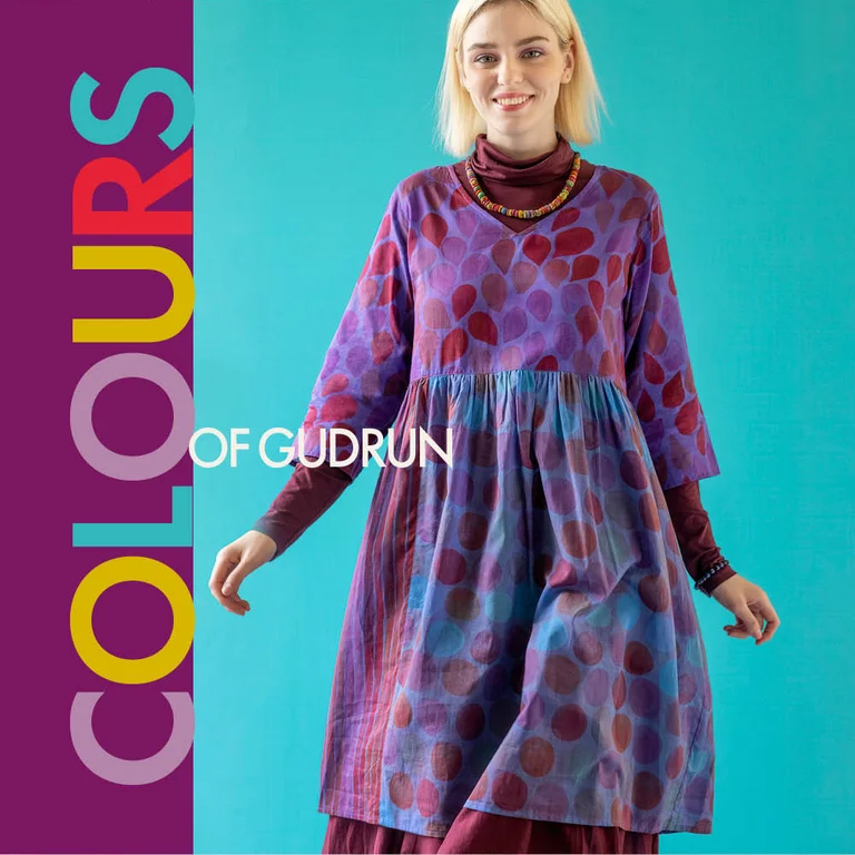 A woman wearing a purple, patterned dress from Gudrun Sjödén’s Paris collection.