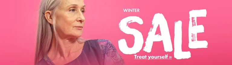 Two women wearing colourful clothes from Gudrun Sjödén.