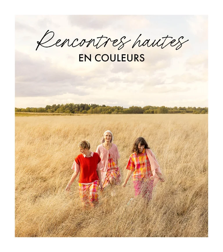 Three women wearing colourful creations from Gudrun Sjödén. 