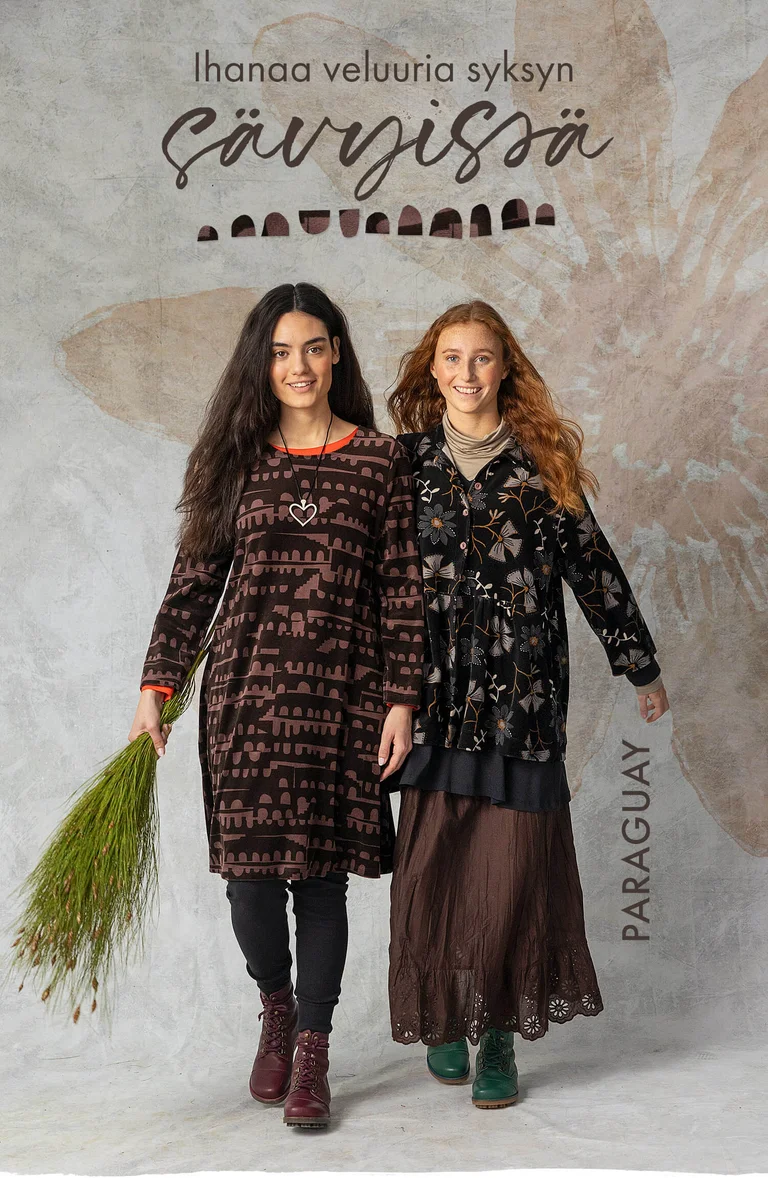 Two women wearing dark coloured clothes from Gudrun Sjödén. 