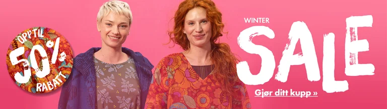 Two women wearing colourful clothes from Gudrun Sjödén.