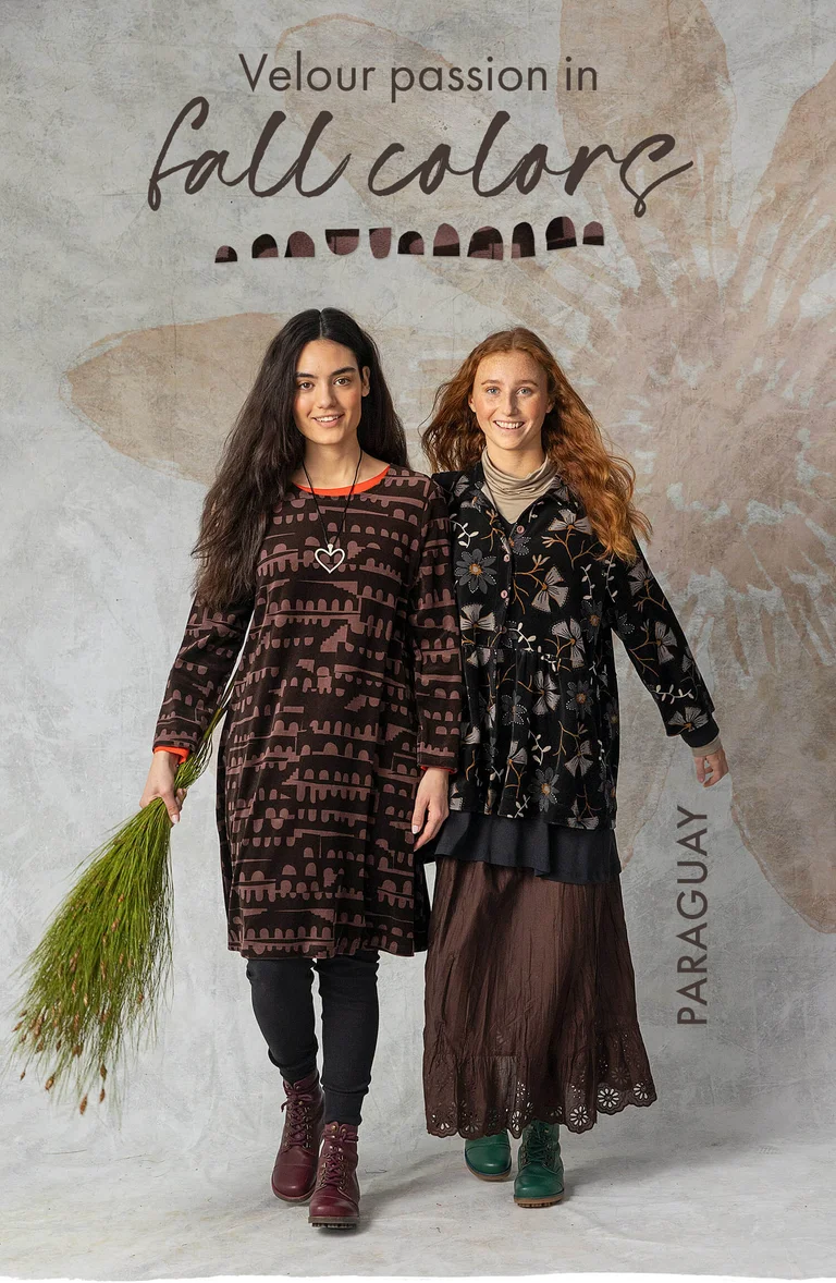 Two women wearing dark coloured clothes from Gudrun Sjödén. 