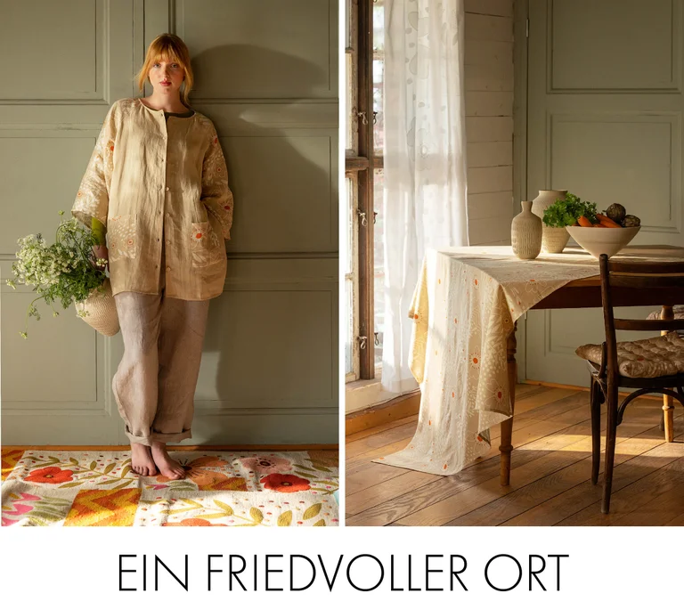 A woman in the “Nemorosa” linen tunic from Gudrun Sjödén on a floral rug from Gudrun Sjödén.