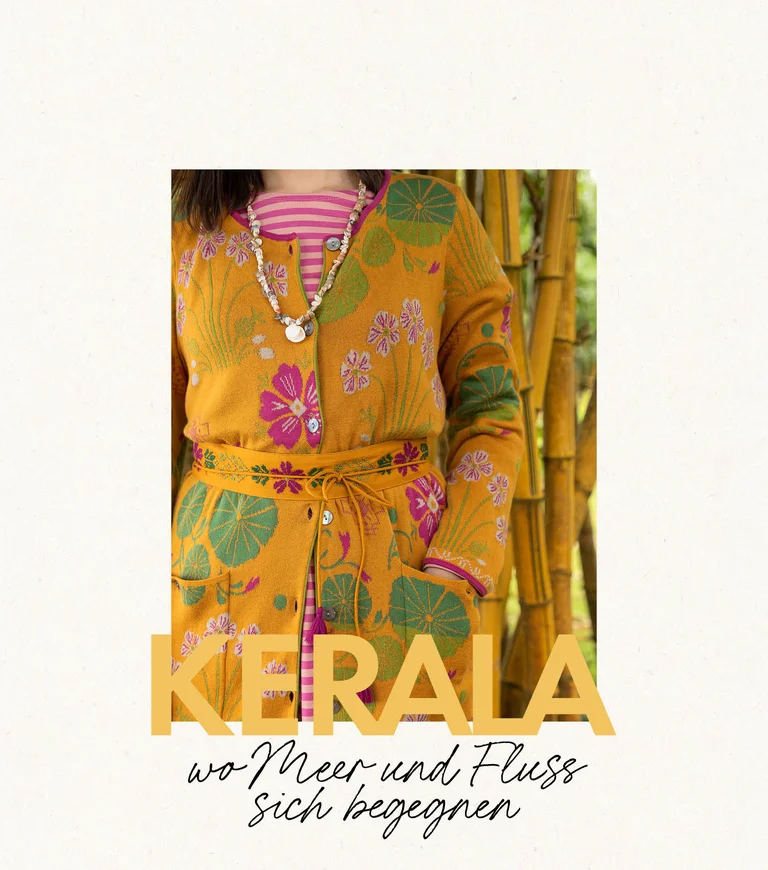 A woman wearing a patterned dress and an open dress from Gudrun Sjödén. 