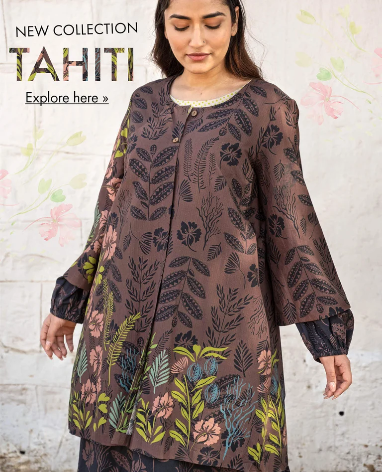 A woman wearing a patterned tunic from Gudrun Sjödén. 
