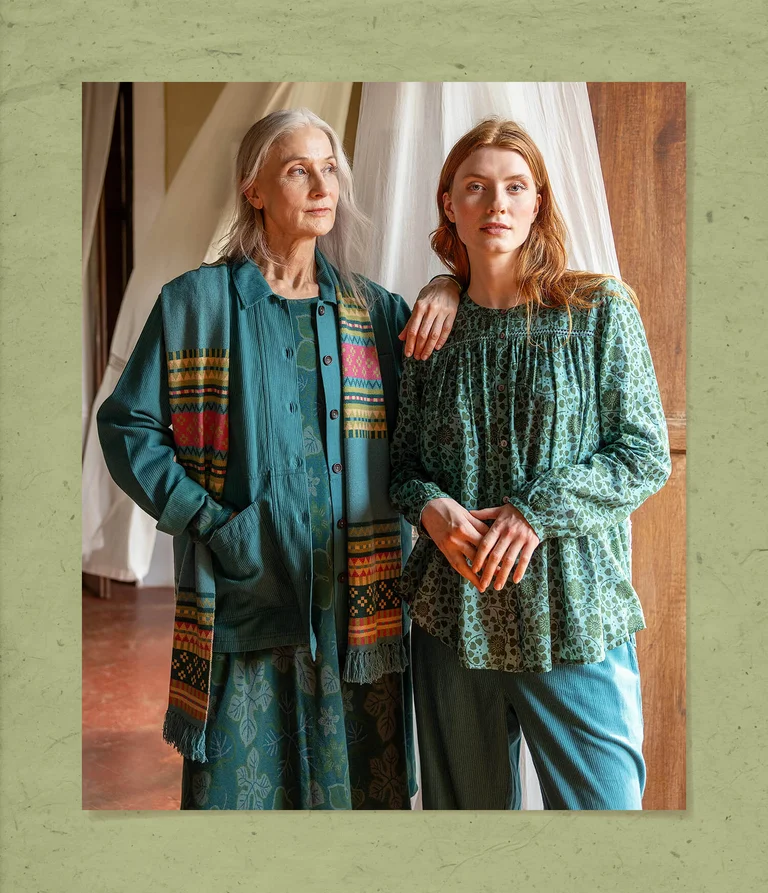 Two women wearing clothes in shades of blue from Gudrun Sjödén.