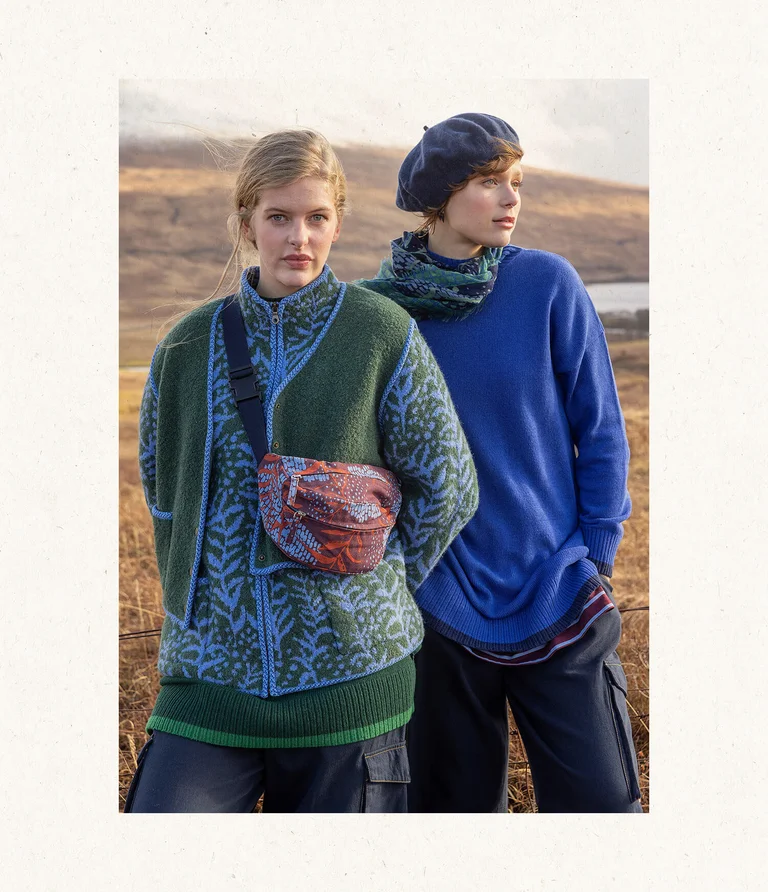Two women next to each other, wearing layers of clothing from Gudrun Sjödén.