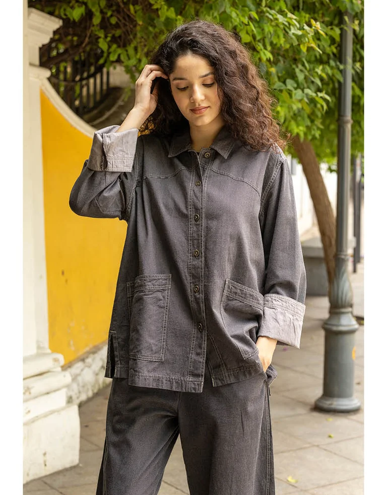 A woman wearing denim-inspired clothes from Gudrun Sjödén.