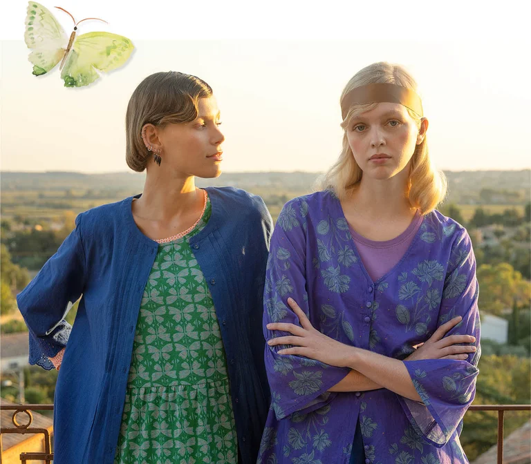 A woman wearing a floral layer from Gudrun Sjödén.