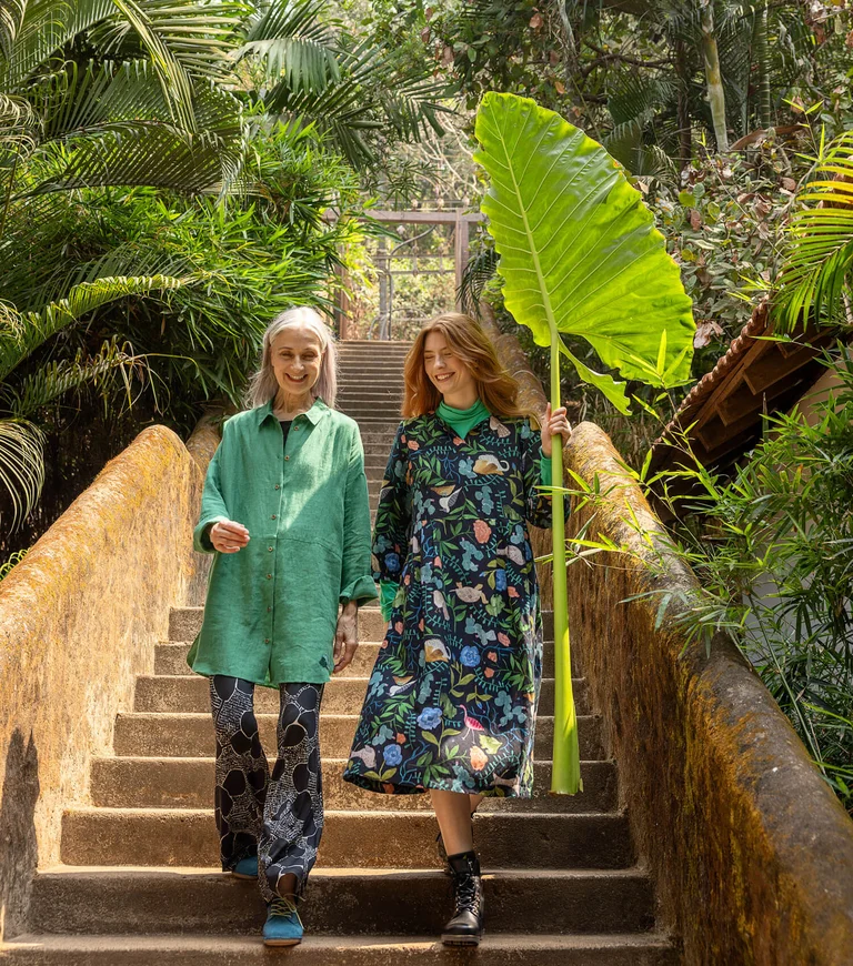 Two women wearing patterned clothes from Gudrun Sjödén.