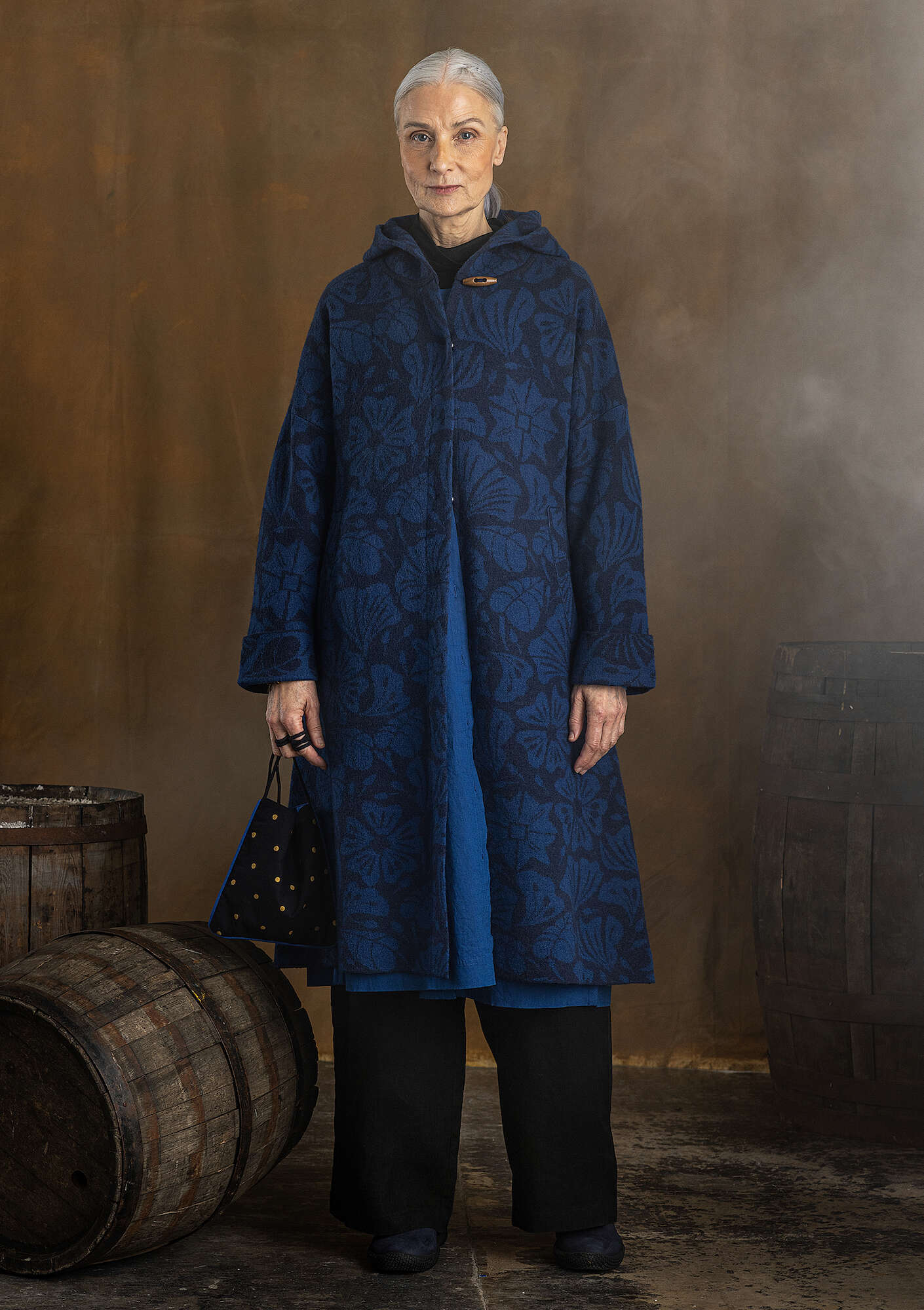 “Wind” knitted coat crafted from felted organic wool dark indigo