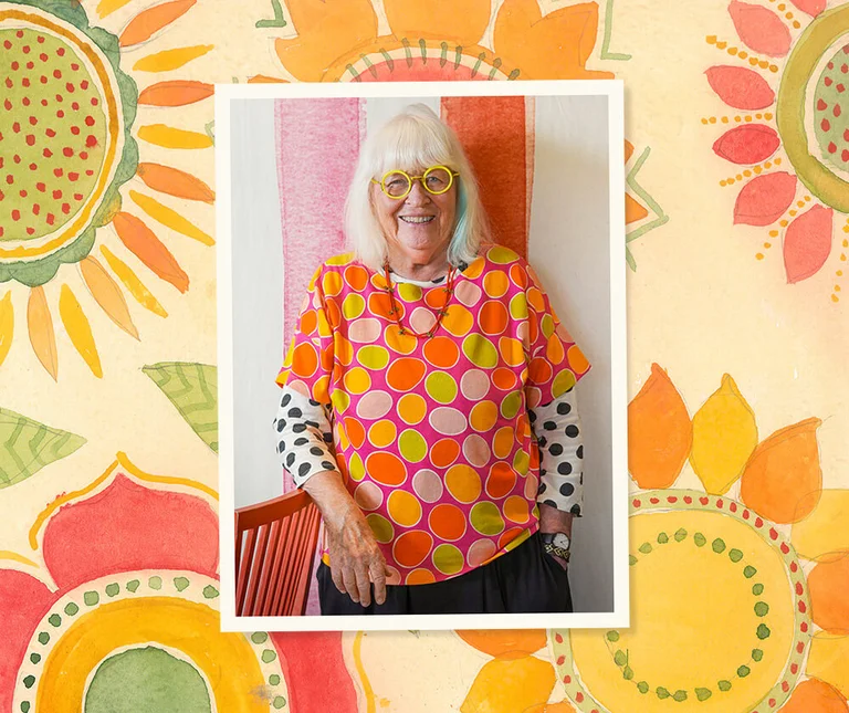 Gudrun Sjödén dressed in a colourful patterned top.