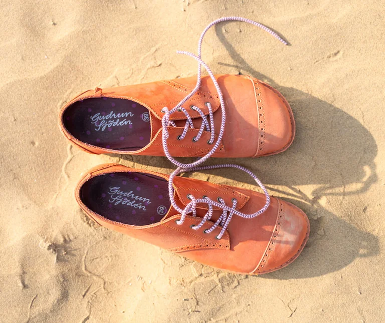 A pair of orange shoes from Gudrun Sjödén. 