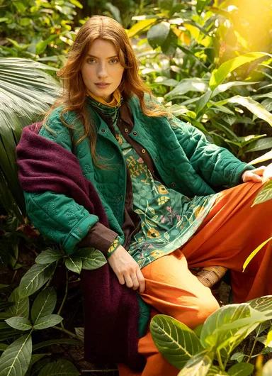 A woman wearing a patterned dress from Gudrun Sjödén. 