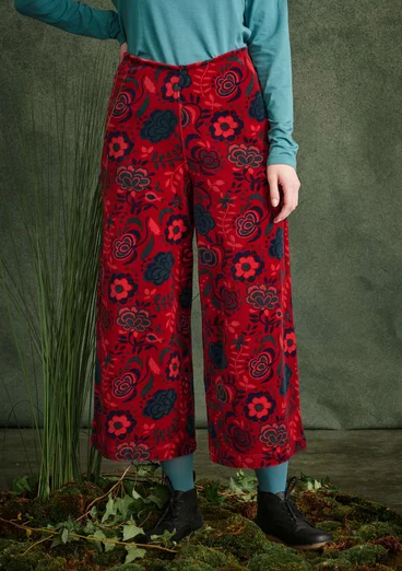Velours broek "Orsa" van biologisch katoen/gerecycled polyester - tomaat/dessin